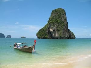 Rock and boat at beach in Thailand
